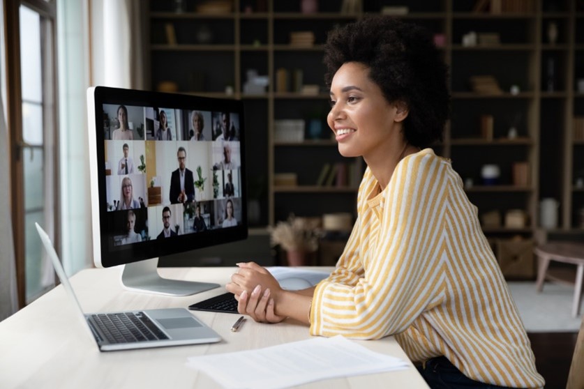 Woman smiling on webinar