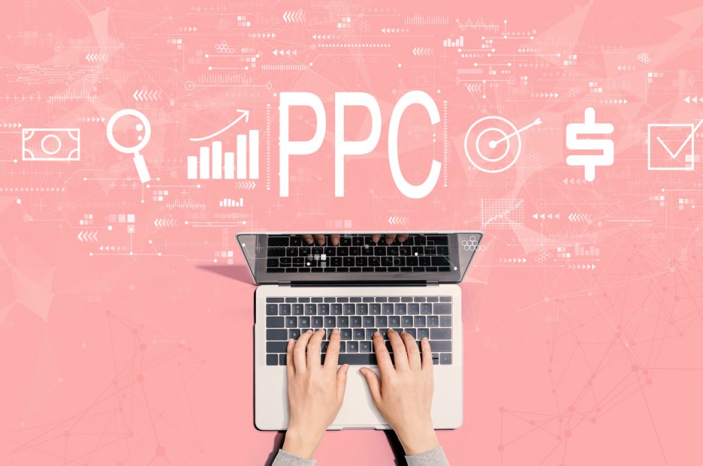 PPC - Pay per click concept with person using laptop