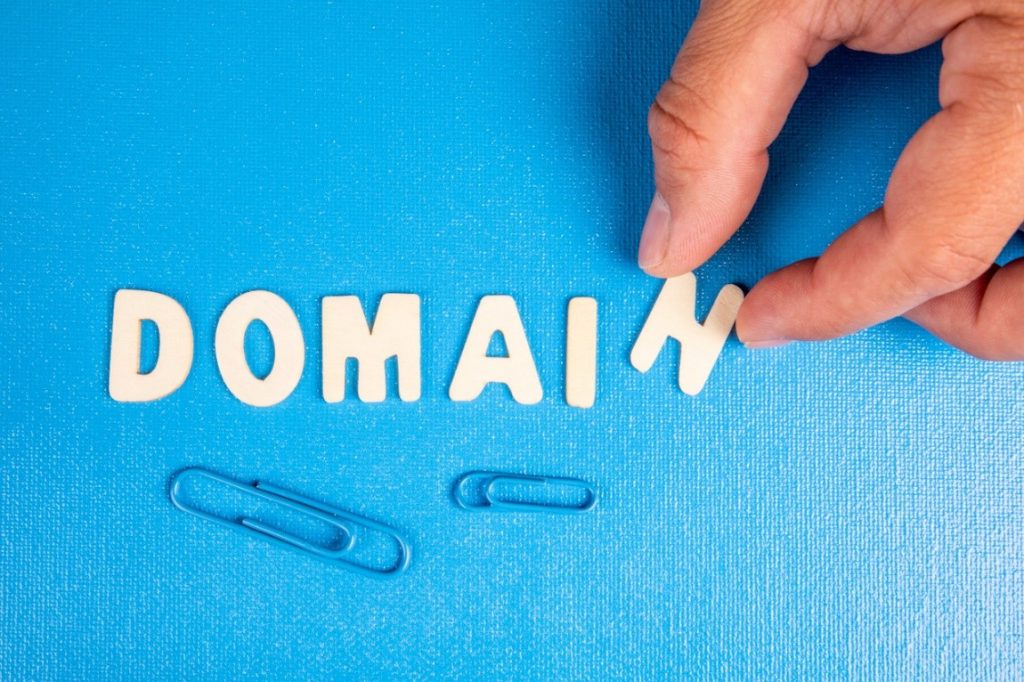 white letters spelling domain on blue background