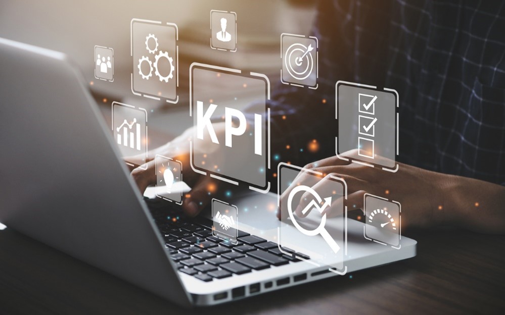 Someone looking up KPIs on a laptop