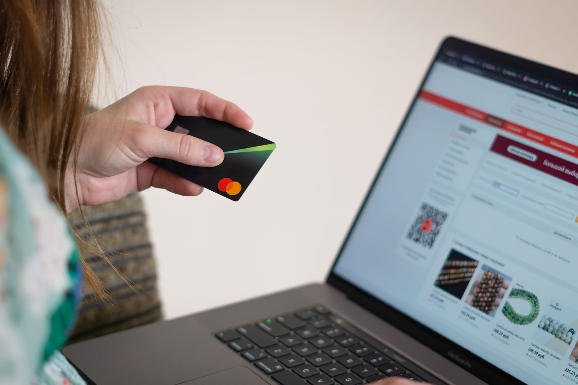 Woman buying something online with card